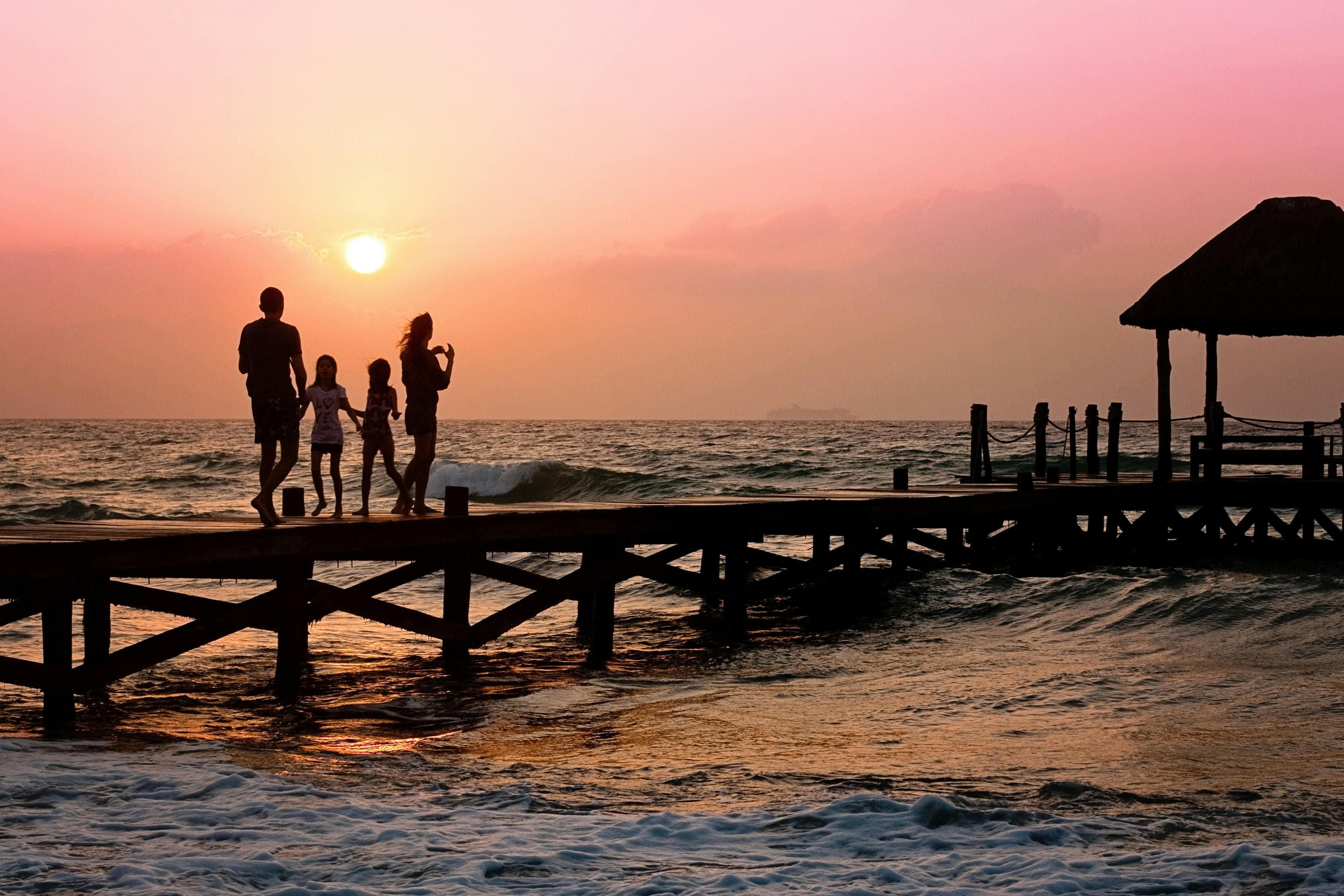 A pier at sunset with warm golden light